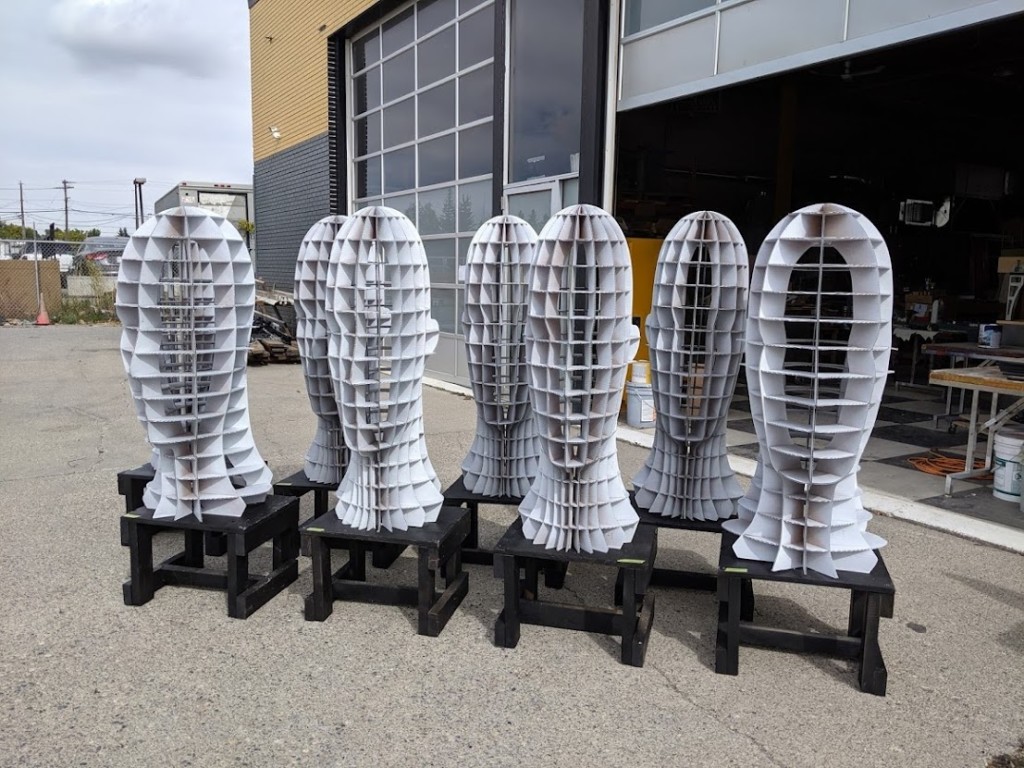 A series of fabricated metal head sculptures by Fuse33.
