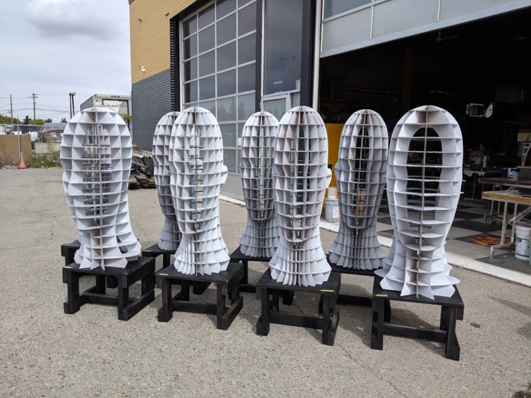 A series of fabricated metal head sculptures by Fuse33.
