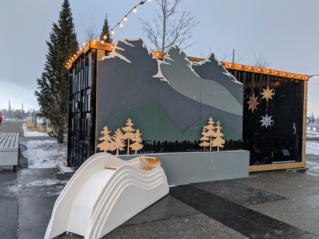 A Hygee Hut with trees and mountains on the side sits in the East Village.