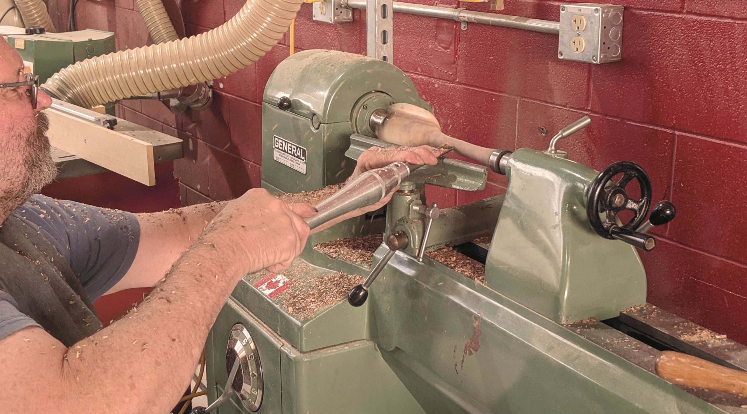 man using lathe at fuse 33 makerspace